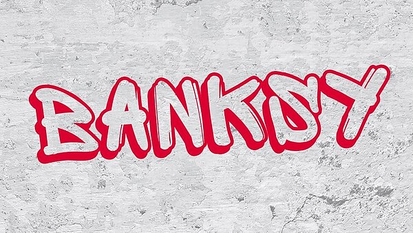 Der Schriftzug Banksy steht in roten Großbuchstaben auf einem grauen Hintergrund.